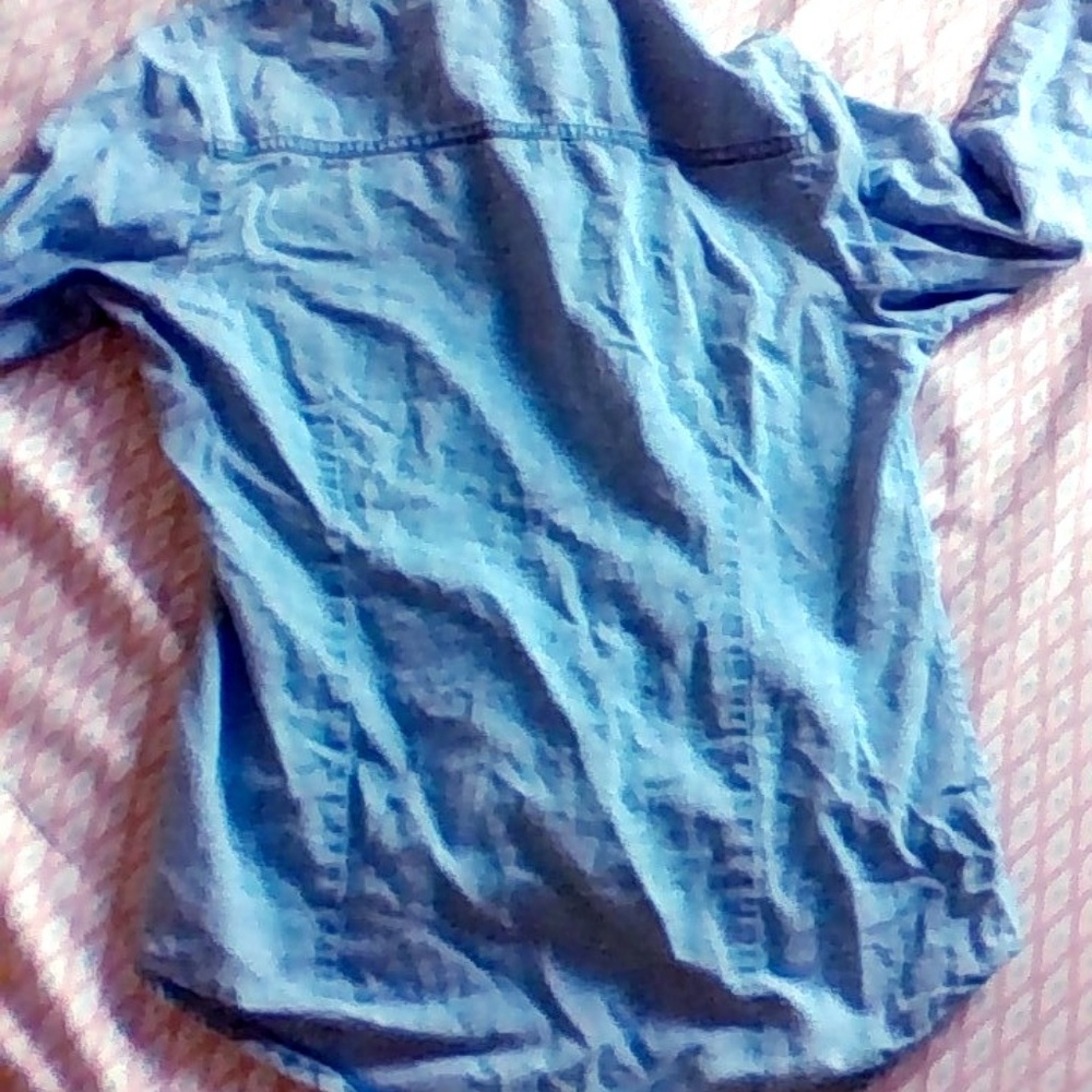Button-up light wash denim jacket.